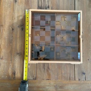 Multiple games in one, has a chess board on the glass